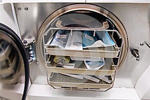 Dental autoclave with dentistÃ¢â¬â¢s tools in a clinic